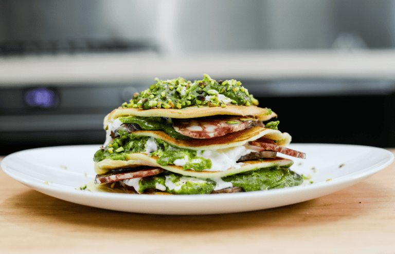 Fresh Sicilian sandwich with greens and cured meats Delicious layered sandwich featuring fresh greens, cured meats, and cheese, showcasing artisanal Sic.