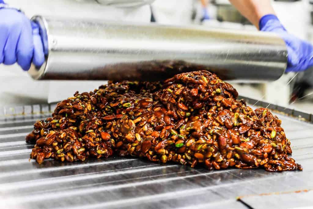 Sweet Sicilian nougat being prepared on a marble surface.