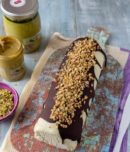 Artisanal pistachio and chocolate roll with crushed pistachios on top.