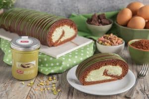 Sicilian pistachio and chocolate roll cake with cream filling.