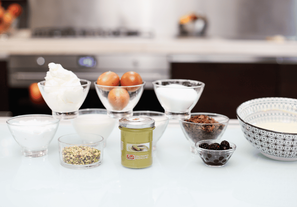 Pistì Sicilian Dessert Ingredients Assorted ingredients for Sicilian dessert preparation on a kitchen counter.