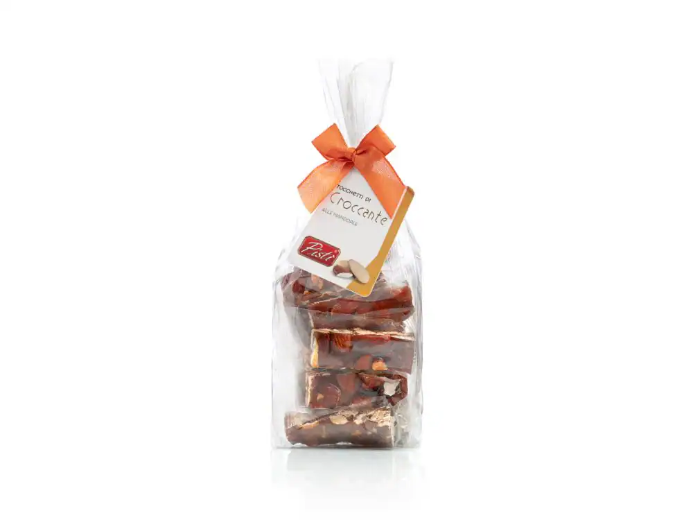 Sicilian almond croccante in clear gift bag with orange ribbon.