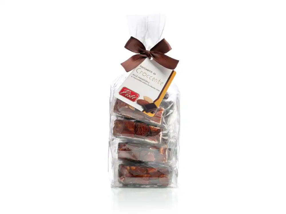Assorted Sicilian artisanal chocolates in a clear gift bag with a brown ribbon.
