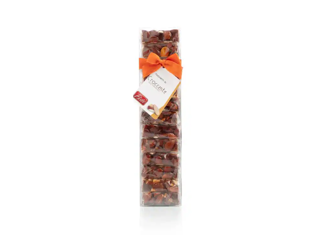 Sicilian dried fruit mix in transparent bag with orange ribbon.