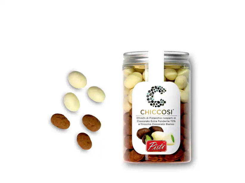 Assorted white and milk chocolate drops in a jar, artisanal Sicilian sweets.