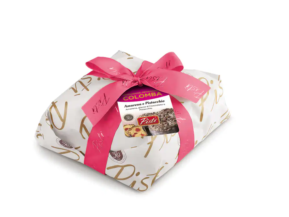 Traditional Sicilian Colomba cake wrapped with pink ribbon and Pistì branding.