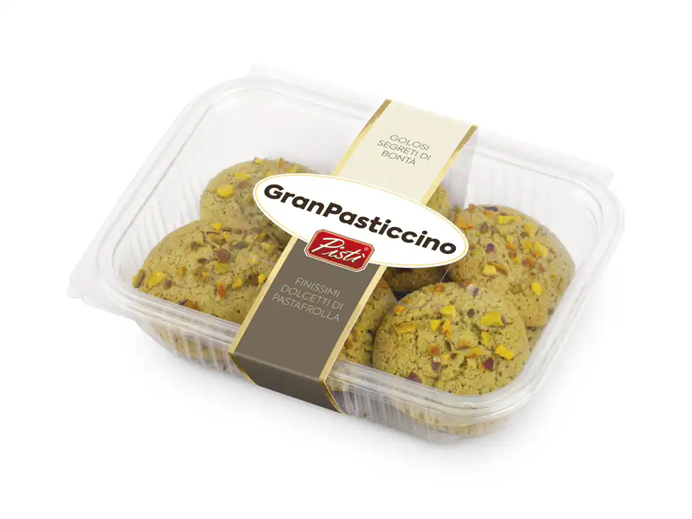 Traditional Sicilian GranPasticcino cookies with pistachios in a clear plastic container.