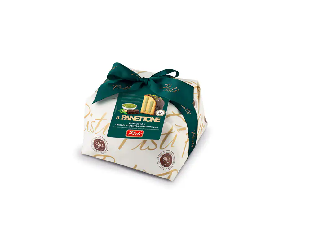 Sicilian artisanal Panettone wrapped with a green ribbon, showcasing traditional craftsmanship.