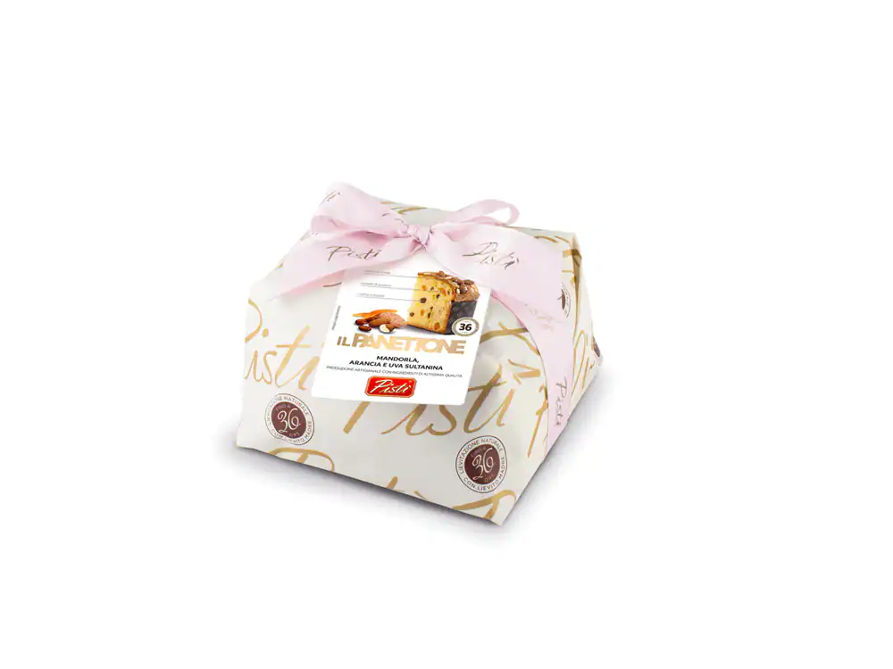 Artisanal Sicilian cake wrapped in elegant paper with pink ribbon.