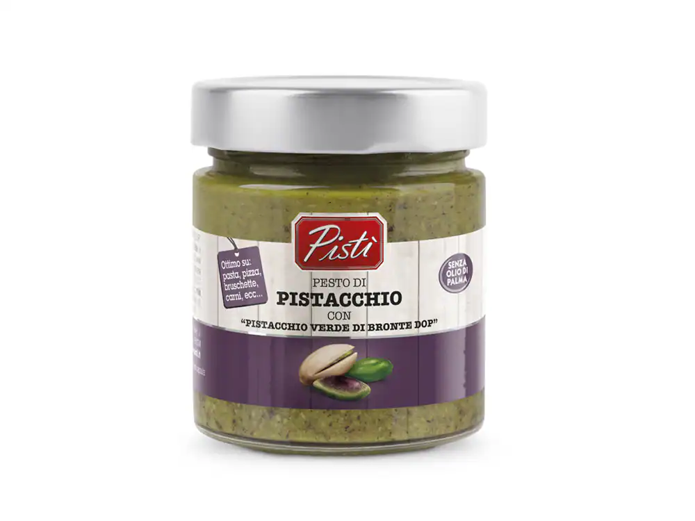 Artisanal Sicilian pistachio pesto in glass jar, authentic flavor.