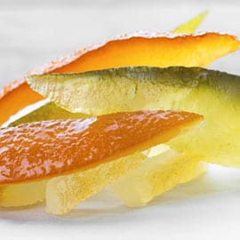 Fette di frutta candita colorate e artigianali, perfette per dolci e snack siciliani.