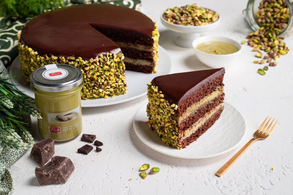 Delicious chocolate and pistachio cake with pistachio coating and layers of rich chocolate.