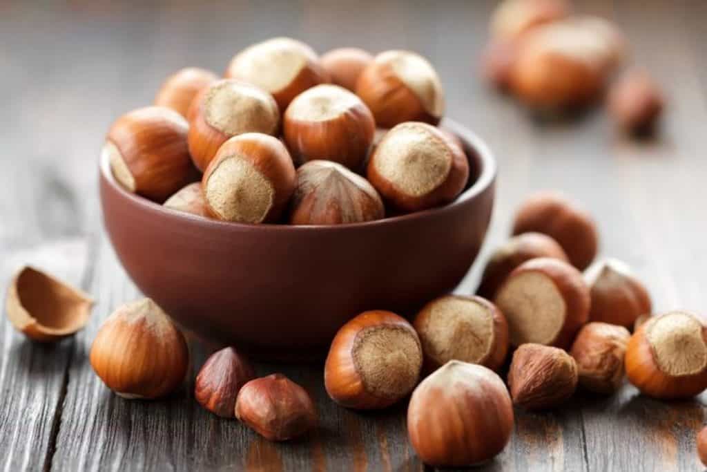 Hazelnuts in a bowl, ready to eat.
