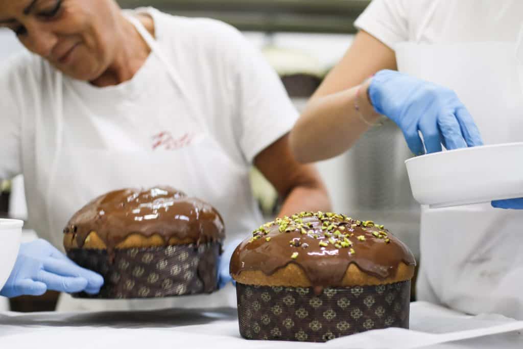 Large artisanal Sicilian Panettone with chocolate glaze and pistachio toppings.